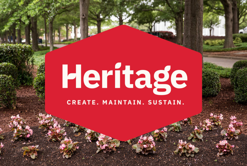 heritage logo overlaying flowers